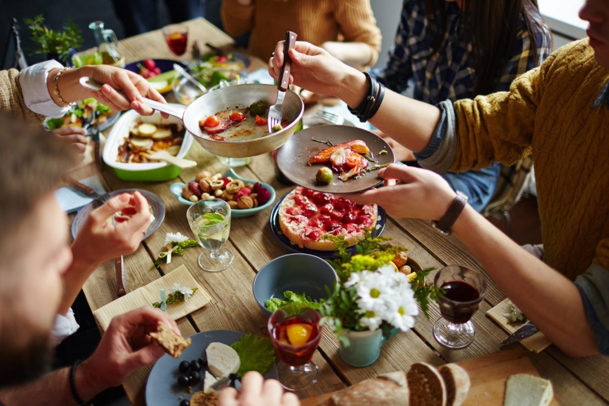 People sharing healthy foods around a table